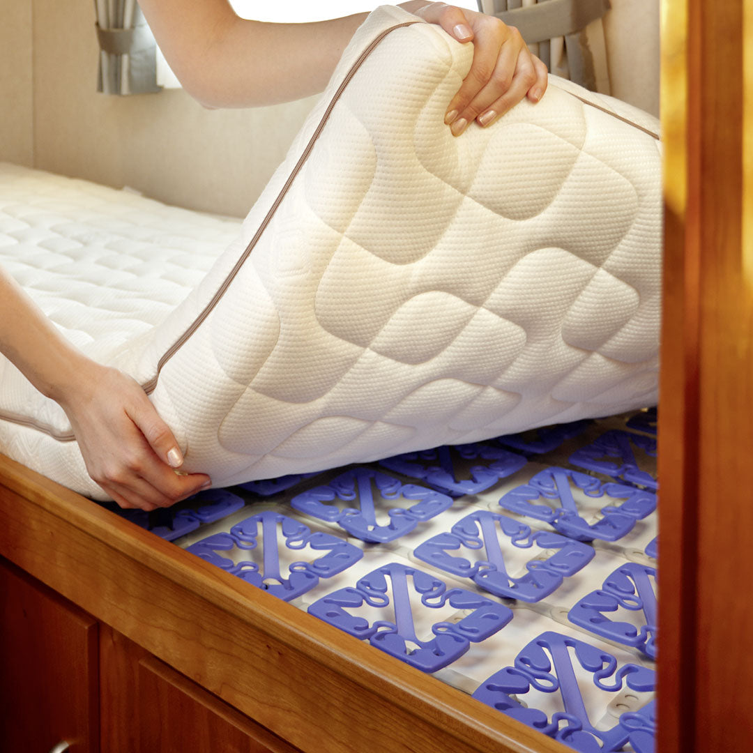 image of raised mattress showing froli star bed spring system installed underneath