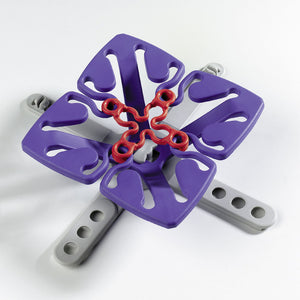 image of froli star dark blue spring assembled to grey base, with red tension clip inserted